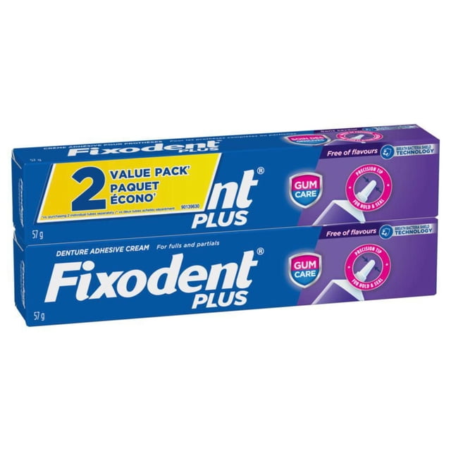 Fixodent Plus Soins des Gencives Adhésif Sécuritaire pour Prothèses, Lot Économique de 2 avec Deux tubes de 57 g, Doté d'Une Pointe de Précision pour une Ligne et une Tenue Adhésives Continues, Sans Saveurs, et Technologie de Protection contre les Bactéries Respiratoires pour Prévenir les Douleurs aux Gencives et les Particules Alimentaires entre Prothèses et Gencives.