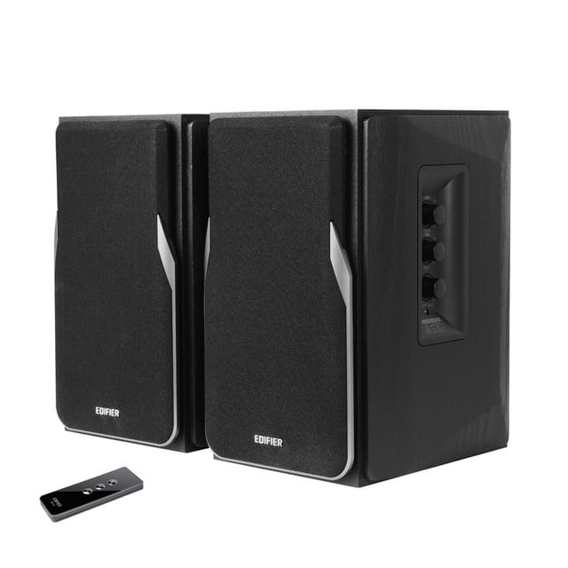 Edifier R1380T Powered Bookshelf Speakers, 2.0 Stereo Active Near Field Monitors in black, featuring a pair of speakers with a sleek MDF wooden enclosure to minimize acoustic resonance. The right speaker includes side panel controls for bass, treble, and volume adjustments. A remote control is also included for convenient operation. These speakers offer dual RCA inputs for connecting two devices simultaneously and deliver 42 watts RMS power output through a built-in Class-D amplifier. Equipped with a TI PCM9211 digital decoding chip, a 25mm tweeter, and a 4-inch mid-bass driver for accurate sound reproduction.