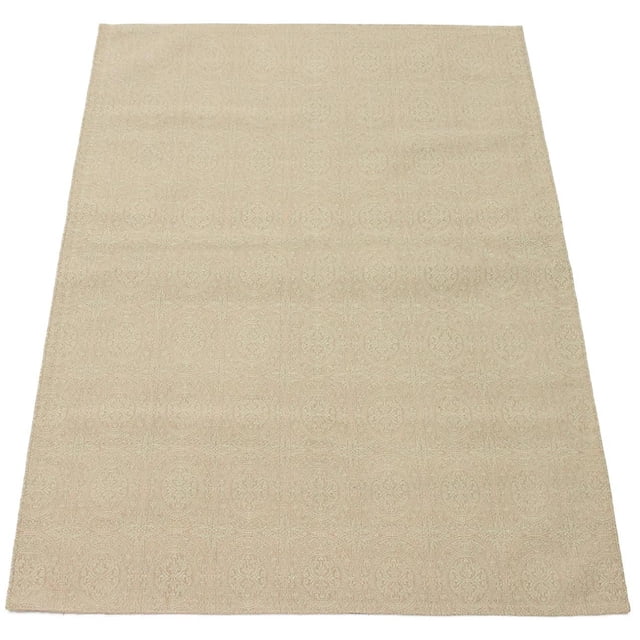 Beige area rug with a subtle embossed circular medallion pattern, shown flat from above, suitable as an accent rug for living rooms or bedrooms.