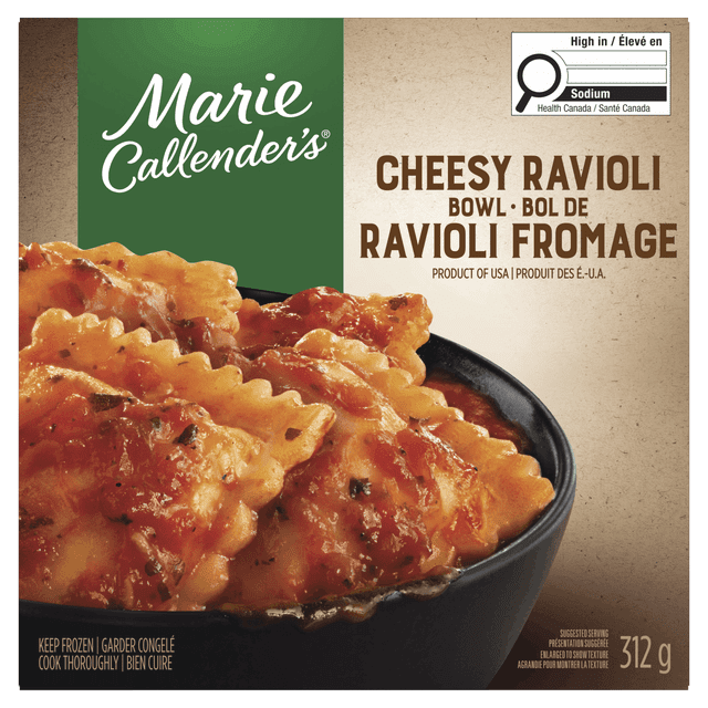 Marie Callender’s Cheesy Ravioli Bowl frozen dinner featuring ravioli stuffed with ricotta style cheese, mozzarella, parmesan, and romano cheeses in marinara sauce, shown in a black bowl on the package front, 312 g with bilingual English-French text and Canadian high sodium warning label.