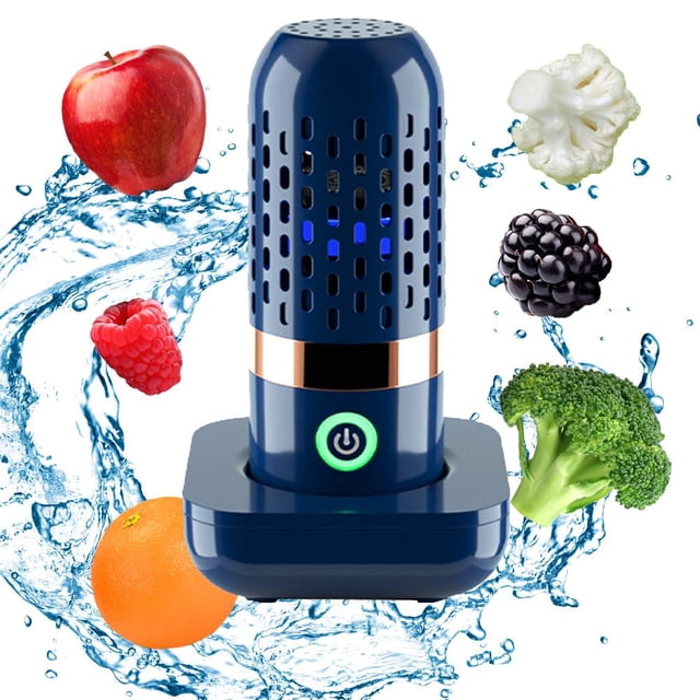 Machine Portable de Nettoyage de Fruits et Légumes avec USB Rechargeable OH Ion par GRM, Présentant un design Cylindrique compact en Bleu Foncé avec des Trous de ventilation et un Bouton d'Alimentation Vert. l'Appareil Utilise la Technologie OH Ion pour un Nettoyage Efficace et Est Entouré d'Éclaboussures d'Eau et de Produits Frais, Y Compris des Pommes, Framboises, oranges, Brocoli, Chou-Fleur et Mûres, Soulignant Sa Fonctionnalité de Nettoyage. Alimenté par une Batterie au lithium Rechargeable et une Recharge USB.