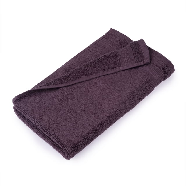 hometrends Solid 100% Cotton Hand Towel, dark purple, folded with a corner turned to reveal soft, highly absorbent 550 GSM cotton terry fabric and a textured border, suitable for bathroom use and creating a coordinated spa-like atmosphere.