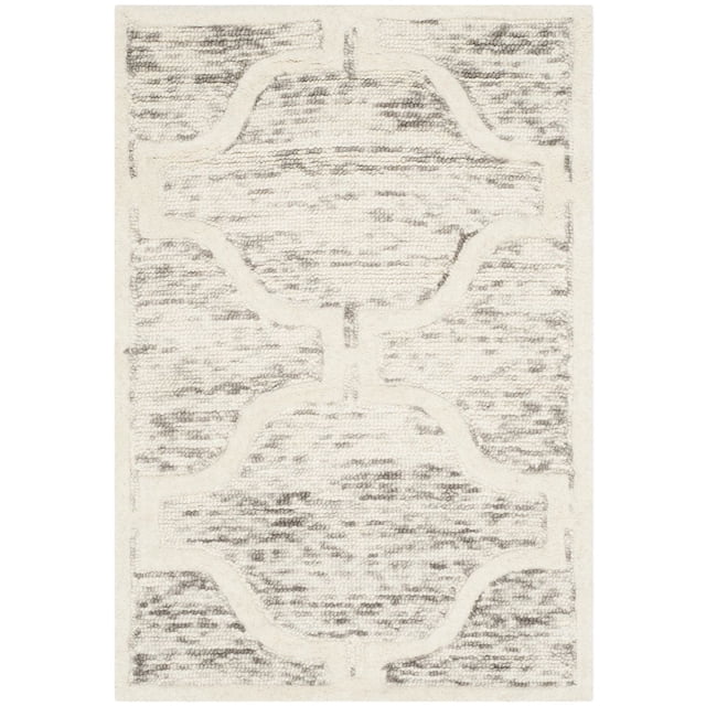 Safavieh Cambridge Kodey Faded Geometric Area Rug in cream and gray tones, hand-tufted wool with a textured faded geometric pattern featuring plush cut piles and high/low loop textures, ideal for modern home or office decor and often used as a decorative accent rug.