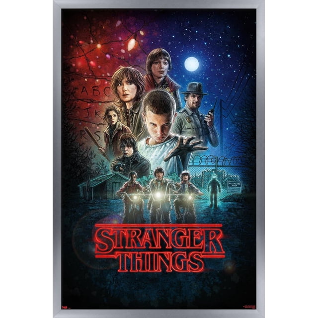 Netflix Stranger Things - One Sheet Wall Poster, 22.375" x 34" depicting illustrated main characters from the series under a starry night sky with a full moon, three kids riding bikes with headlights on, a sheriff holding a walkie-talkie, and a background of glowing Christmas lights forming alphabet letters, framed in silver with the red neon Stranger Things logo at the bottom.