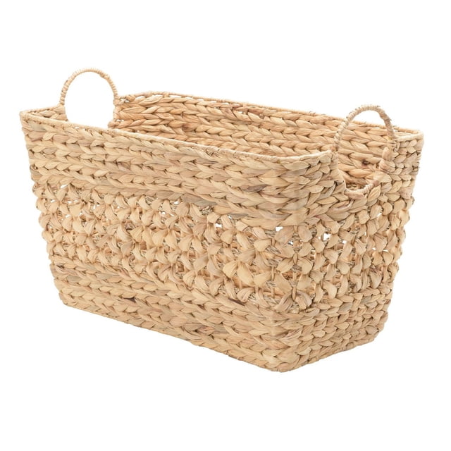 Water Hyacinth and Seagrass Storage Basket with a rectangular shape woven from natural beige fibers, featuring looped handles for easy carrying, measuring 21 in. L x 11.5 in. W x 13.5 in. H, ideal for home storage and organization, and suitable for storing pet toys or household items.