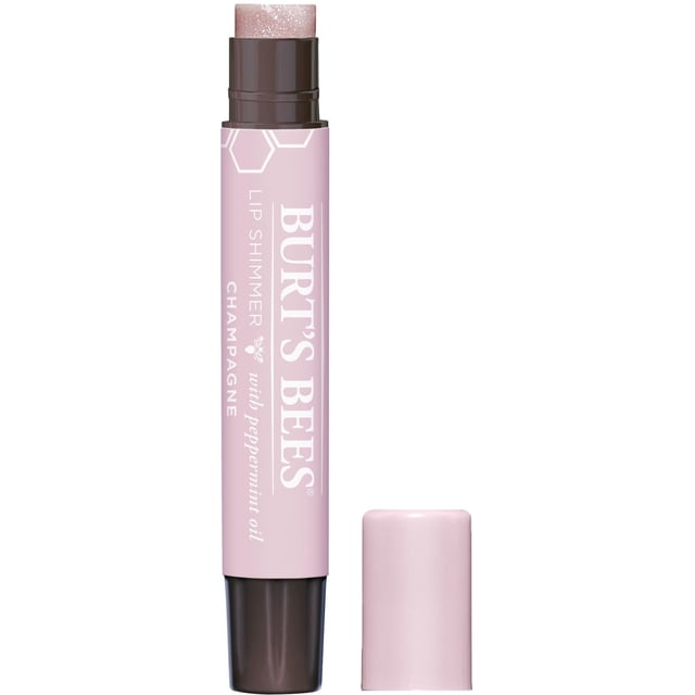 Burt’s Bees 100% Natural Lip Shimmer in Champagne, a pink tube with dark brown base and removed cap, revealing a shimmering light pink balm stick with peppermint oil, suitable for moisturizing and adding natural lip colour.