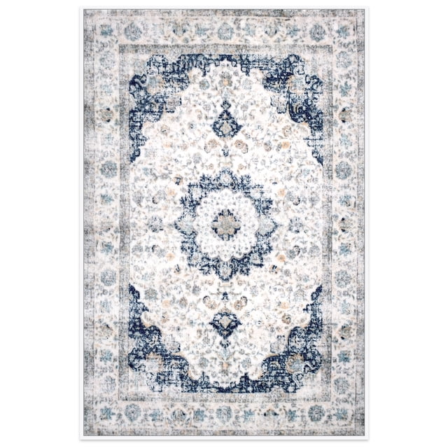 Meafeng 2.6' x 3.9' Area Rugs, Washable Vintage Rugs for Living Room Bedroom, Low Pile Non-Slip Carpet 3x4, Blue centered front-facing rectangular low-pile vintage floral rug in muted blue and grey with a distressed medallion motif; polyester surface appears smooth, stitched edges and thin non-slip backing visible at a lifted corner; placed on hardwood floor with sofa and coffee table legs in soft living room lighting, machine-washable and suited for living room or bedroom use.