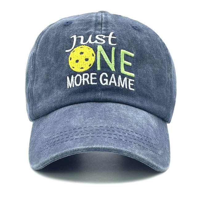 Embroidered Pickleball Hat for Men Women, a washed denim dad hat with 'Just One More Game' embroidery on the front. Made of 100% cotton, featuring a low-profile six-panel design, adjustable metal buckle closure, and pre-curved visor for UV protection. Includes six embroidered eyelets for breathability. Ideal for outdoor activities like pickleball, walking, fishing, and golf.