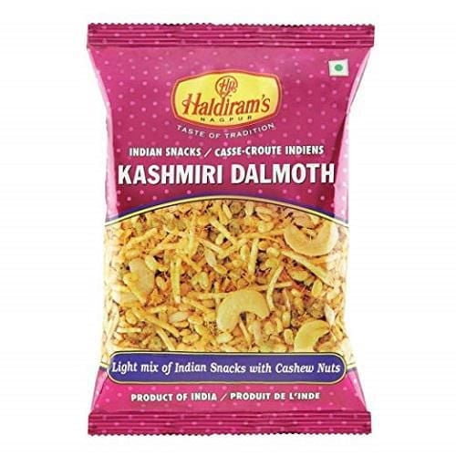 Haldiram Kashmiri Dal Moth Indian snack mix in a pink and purple bag featuring a blend of green gram, noodles, potato sticks, and cashew nuts, a traditional Namkeen snack from India ideal for quick and spicy snacking.