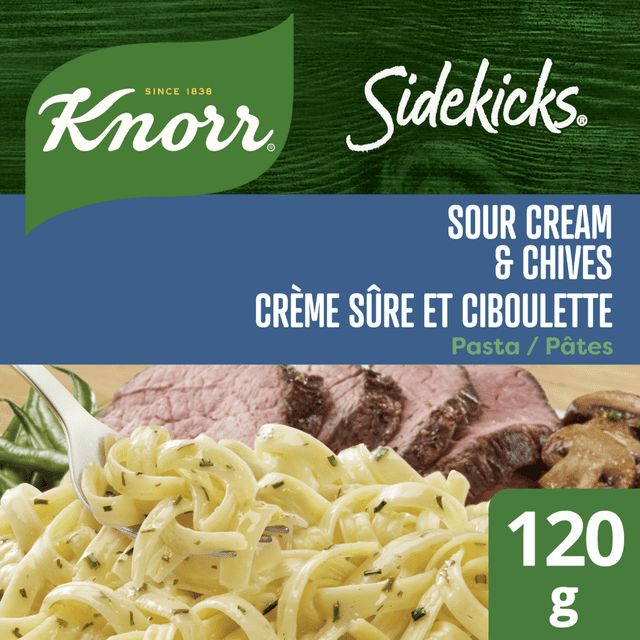 Knorr Sidekicks Sour Cream & Chives Pasta Side Dish package showing creamy pasta with chives served with sliced beef and mushrooms, labelled 120 g, bilingual English and French text on green and blue background, suitable for quick and easy pasta side meals.
