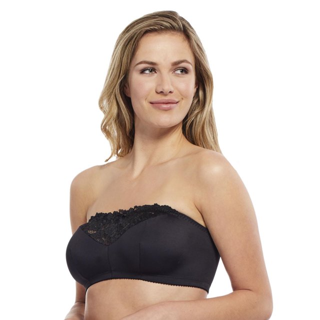 Carole Martin Strapless Comfort Bra in black, shown on a model from a front 3/4 angle, featuring a wire-free, unpadded bandeau design with floral lace trim and stretch microfiber fabric, designed for casual comfort with shirred elastic that prevents rolling and fits B to D cup sizes.