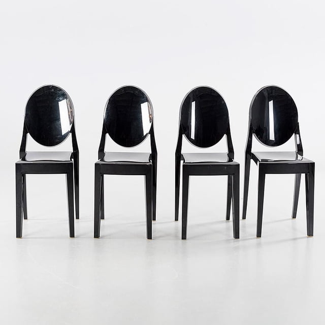 Heavenly Collection black plastic armless chair for dining room or kitchen, set of four stackable chairs with glossy oval backrests and square seats, made of durable molded plastic, measuring H35.5 (SH18) x W15.5 x D19.5 inches, suitable for indoor and outdoor dining seating with a modern ghost-style design.