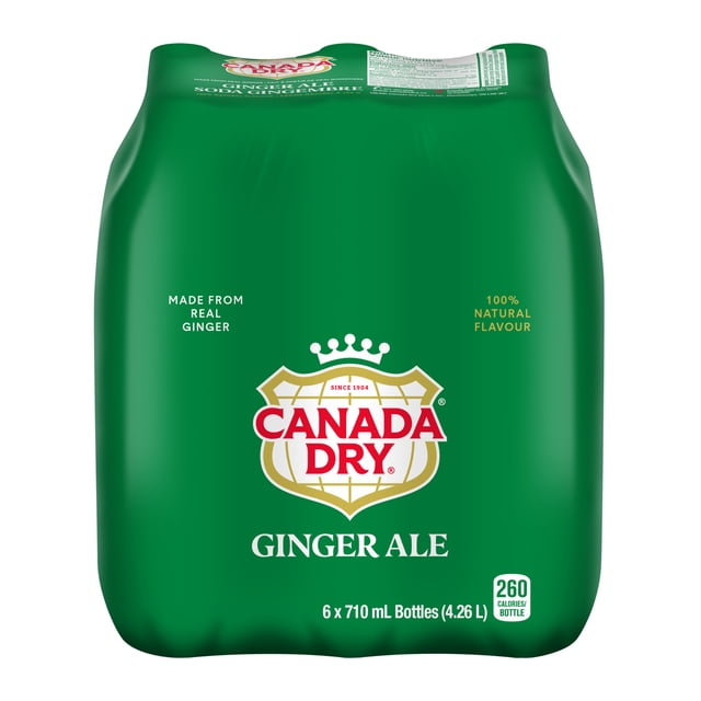 Canada Dry® Ginger Ale 710 mL Bottles, 6 Pack in green shrink wrap featuring the Canada Dry logo with crown and shield, made from real ginger with 100% natural flavour, caffeine free soft drink containing 260 calories per bottle, ideal for refreshing beverages or mixing cocktails.