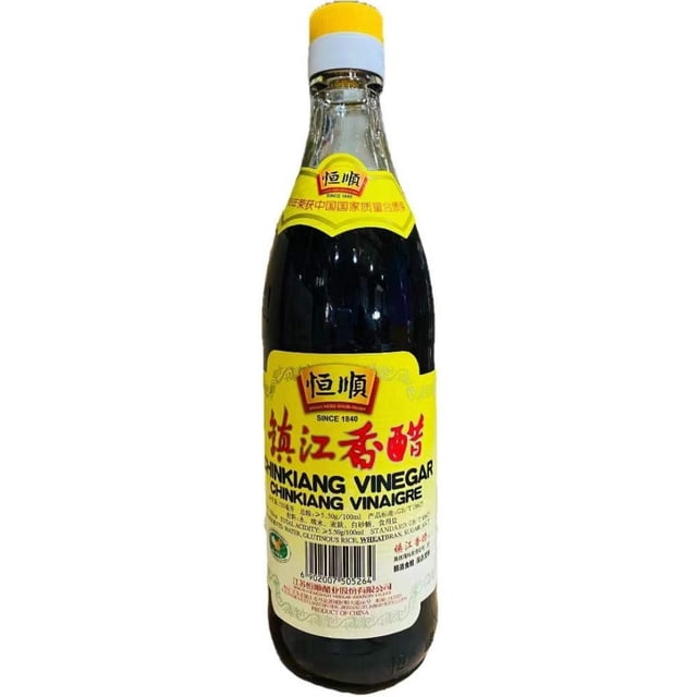 HENGSHUN ZHENJIANG VENIGAR bottle containing dark brown Chinese vinegar in a clear glass bottle with a yellow label featuring red and black Chinese and English text and a yellow screw cap, ideal for Asian cooking, marinades, and dipping sauces.