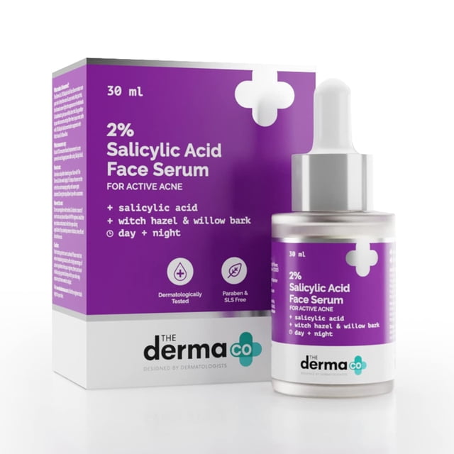 The Derma Co Sérum à l'Acide Salicylique à 2 % 30 ml, un Sérum facial Conçu pour la Peau Sujette à l'Acné. le Produit Comprend une Bouteille Compte-Gouttes de 30 ml et une Boîte Violette et Blanche avec des Détails sur Ses Propriétés Anti-Acné. Testé Dermatologiquement et Sans Parabènes Ni sulfates, Aide à Déboucher les pores, à Contrôler l'Excès de Sébum et à Réduire les Poussées d'Acné. Convient à Tous les types de Peau, en Particulier la Peau Grasse