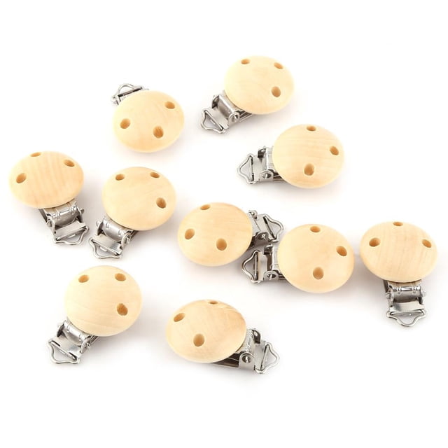 Qiilu 10pcs/lot Cute Round Wood Natural Baby Pacifier Clip Charm Infant Nipple Clasps with 3 holes. Made of high-quality wood and iron, these lightweight and compact clips are non-toxic, odorless, and safe for infants. Ideal for pacifiers, clothing accessories, and ornaments. Includes 10 pieces in natural color, each measuring approximately 4.4 x 3cm (1.7 x 1.2in).