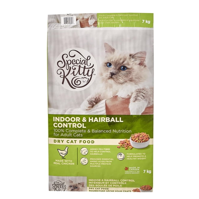 Special Kitty Indoor & Hairball Control Dry Cat Food 7 kg bag featuring a fluffy cat with blue eyes on the front. The packaging highlights 100% complete and balanced nutrition for adult cats, made with real chicken, added pea fibre to help control hairballs, essential amino acids from multiple protein sources, and formulation to promote healthy weight. Made in Canada from domestic and imported ingredients. The front also shows a bowl of multicolored dry cat food kibbles.