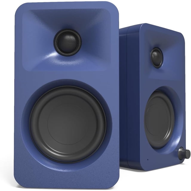 Kanto ORAMU 100W powered reference desktop computer speakers in indigo, designed for creators, gamers, and musicians. Features include Bluetooth 5.0, USB-C input, and bi-amplified Class-D power. Equipped with 3-inch woofers, ¾-inch silk dome tweeters, and a 100 Hz automatic crossover for seamless subwoofer integration. Ideal for desktop audio and computer peripherals.
