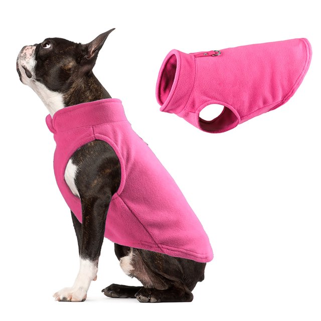 TIMIFIS Dog Clothes Pet Clothes Dog Clothes Thick Solid Color Fleece For Pet Dogs. A small black and white dog wearing a bright pink fleece sweater, designed for small and medium-sized dogs. The sweater features a sleeveless design with a high collar and a snug fit, suitable for spring, autumn, and winter. The image also shows a close-up of the fleece material, highlighting its soft texture and vibrant color. Ideal for keeping pets warm during outdoor activities or festive occasions like Christmas.