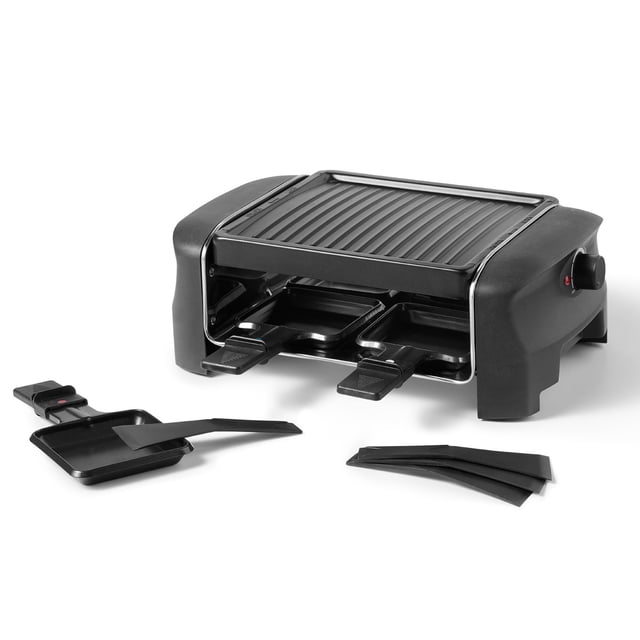 Starfrit 4-Person Party Grill Raclette with a black non-stick ribbed grill plate, adjustable temperature control knob, two removable raclette trays with handles, spatula, and four black scrapers, suitable for grilling meats and melting cheese at small gatherings.