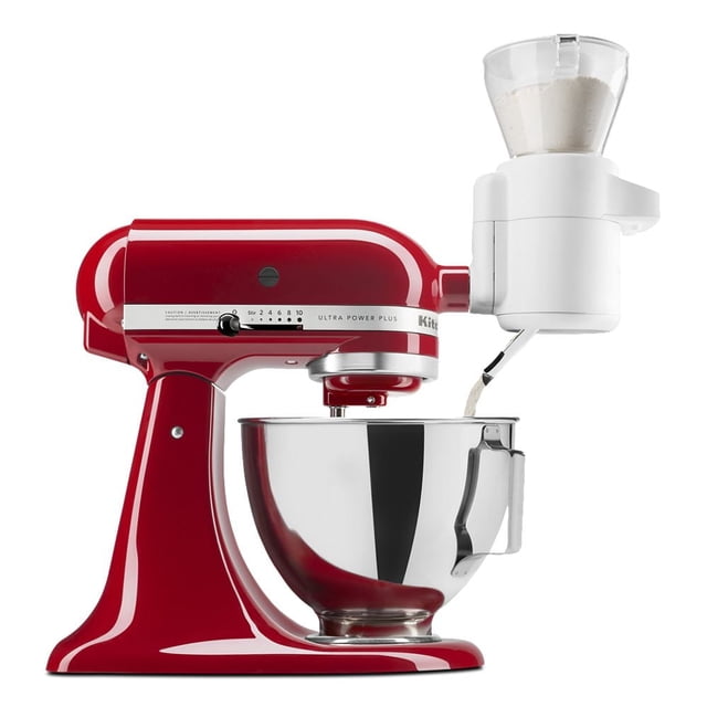 KitchenAid® Sifter + Scale Attachment connected to a red KitchenAid Ultra Power Plus stand mixer with stainless steel bowl, featuring a white sifter with clear hopper dispensing sifted flour into the bowl for accurate baking.