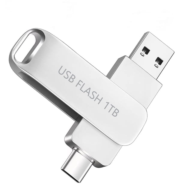 1T USB Flash Drive-2 in 1 Thumb Drive with USB and Type C Port in a silver finish. This dual-port flash drive features USB Type-C and USB-A connectors for OTG functionality, enabling fast data transfer across laptops, PCs, Android smartphones, and tablets. With 1TB expandable storage, it is waterproof, durable, and ideal for storing photos, videos, and documents.
