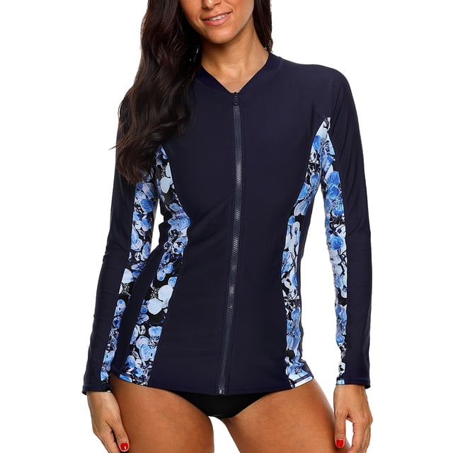 Charmo Women's Zip Front Rash Guard Long Sleeve Rashguard Top Sun Protection Swim Shirt in a navy blue colour with floral printed panels along the sides and sleeves. Features a front zipper for easy wear, a crew neck, and raglan long sleeves for full range of motion. Made from quick-dry, stretchable fabric with UPF 50+ sun protection, ideal for swimming, surfing, and other water activities.