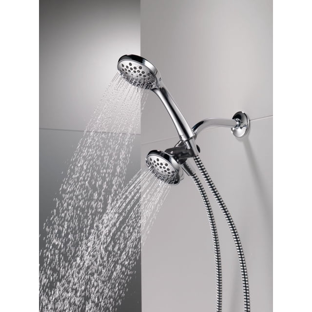 Peerless 3-Setting Shower Combo Pack in Chrome with dual shower heads spraying water, 60-inch flexible hose, diverter for single or shared use, and Touch-Clean spray holes to easily wipe mineral build-up, mounted on a tiled wall.