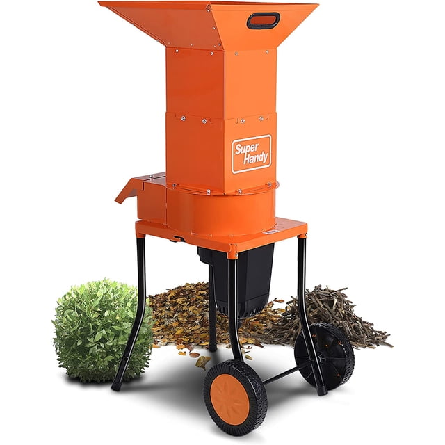 SuperHandy Small Branch Chipper Leaf Mulcher - 120VAC 60Hz Electric Shredder, featuring a bright orange steel housing with a sturdy powder-coated frame. The shredder includes a top feeding port, two 6-inch wheels for portability, and a black collection bin at the base. Designed for handling small branches and twigs up to 0.5 inches in diameter, it operates with a 15-AMP 1800 Watt motor and three 11-inch blades spinning at 4,100 RPMs. The background shows piles of shredded leaves and twigs, emphasizing its use for outdoor waste management.