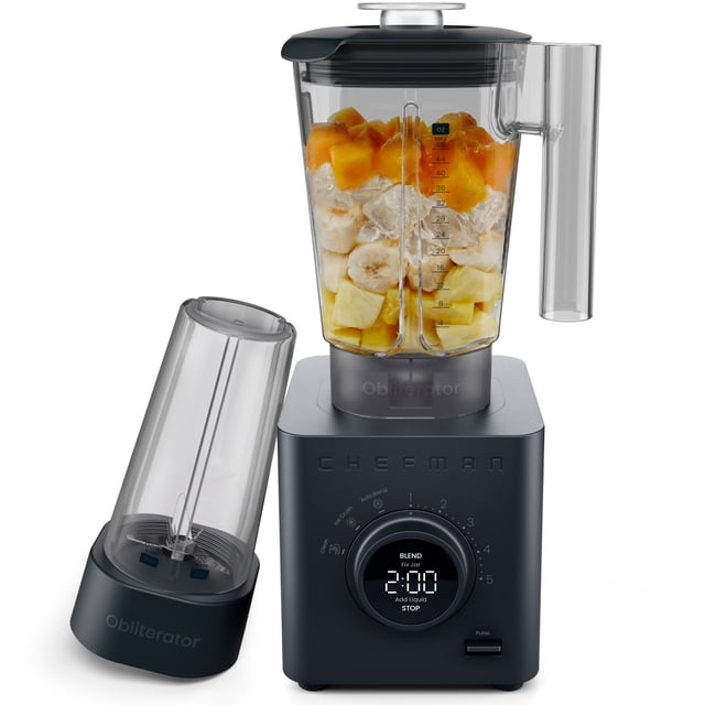 Chefman Obliterator 48oz Countertop Blender in a matte-black finish, featuring a 48 oz shatter-resistant Tritan blending jar filled with fruit and ice, alongside a 20 oz travel jar with blade assembly. The blender includes a digital control panel with six blending speeds, three preset functions, and an Auto Blend feature for optimized blending. Accessories include a tamper/scraper tool and a BPA-free lid with a built-in measuring cup.