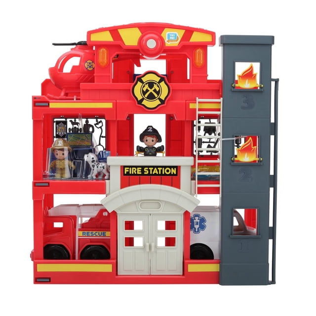 Kid Connection Fire Station Playset with a red three-story fire station featuring a white front entrance labeled 'Fire Station', a gray side tower with fire decals and floor numbers, two firefighter figures, a Dalmatian dog, a red rescue fire truck, and a white ambulance with a blue medical symbol, designed for imaginative rescue and vehicle play.