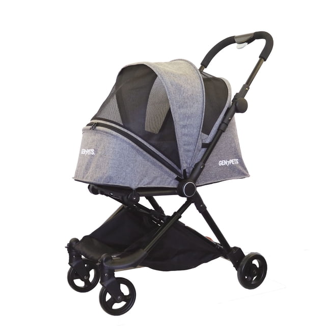 Gen7Pets Genius City Pet Stroller in heather black with ultra-compact fold, lightweight aluminum frame, mesh canopy skylight, front mesh windows, foam cushion handle, and built-in storage basket, shown in a 3/4 profile view on white background, suitable for city living and pet comfort.