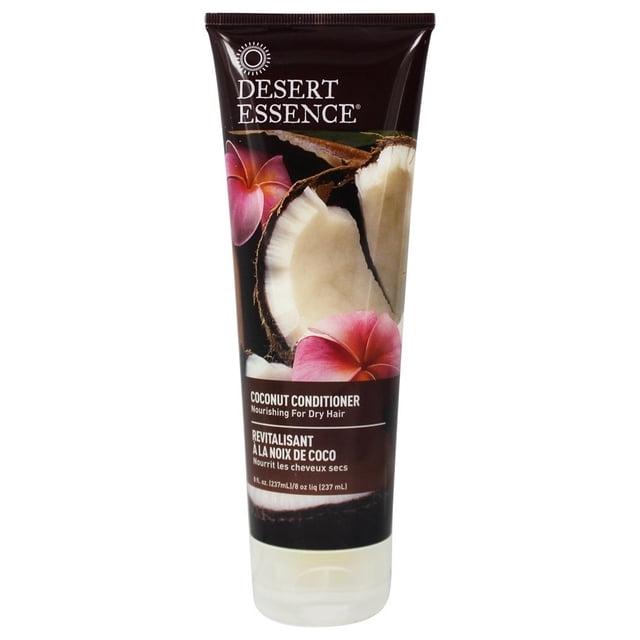 Desert Essence Coconut Conditioner for Dry Hair in a 237 ml brown squeeze tube featuring a cracked coconut and pink flowers on the label, formulated to nourish and soften dry hair with organic coconut oil, suitable for daily use.