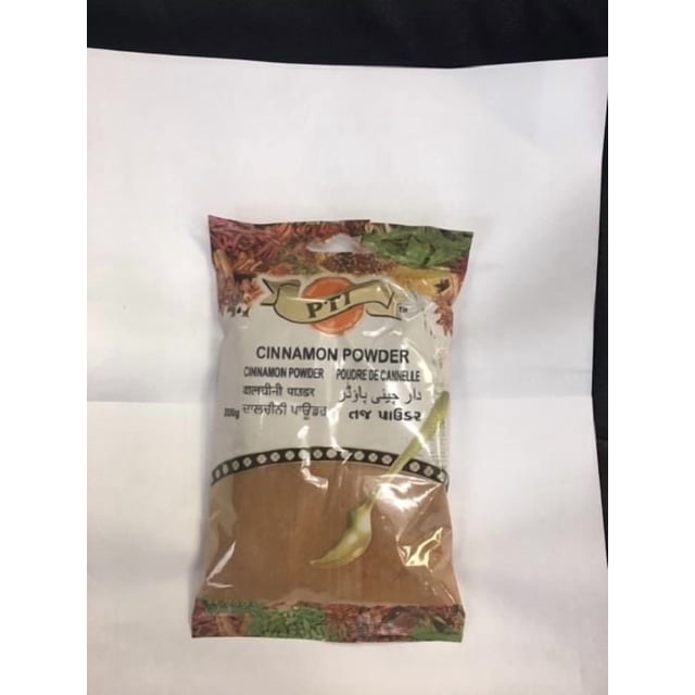 PTI Cinnamon Powder 200g in a clear plastic bag with a beige label featuring the PTI logo and multilingual text, showing finely ground brown cinnamon powder, ideal for flavouring sweet dishes like cakes and rice pudding.