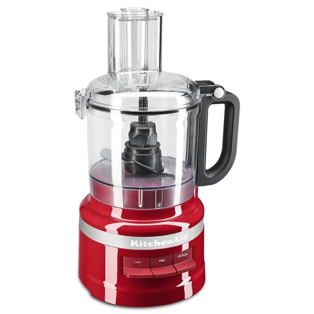 KitchenAid® 7 Cup Food Processor in red with clear plastic work bowl and lid, black handle, and three speed control buttons labeled Low, High, and Off/Pulse on the base, ideal for chopping, shredding, slicing, and pureeing with easy-clean, snap-and-go assembly and built-in blade storage.