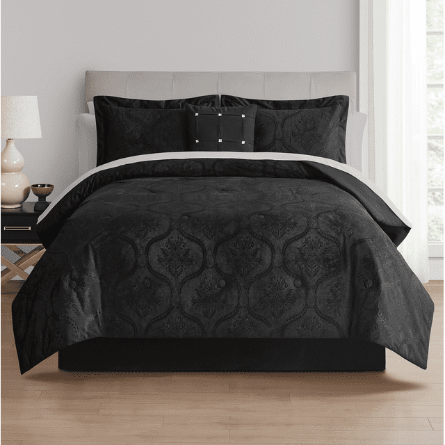 Queen size Mainstays 11-piece black velvet comforter set with decorative pillows and white sheet accents on beige upholstered headboard