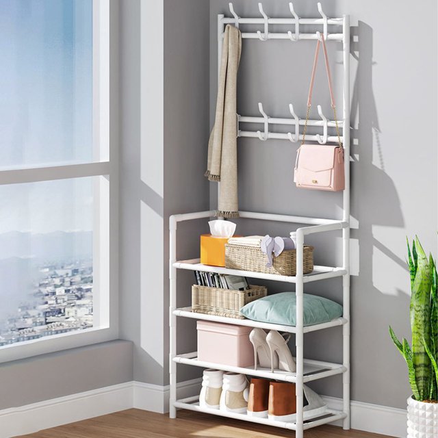 Wzzjkit Shoe Rack for Closet, a multifunctional white storage rack with multiple layers and hooks. The rack features a sturdy polyester frame and is designed for organizing shoes, coats, and accessories. It is shown in a bright indoor setting near a window, with various items like shoes, baskets, and a handbag neatly arranged on its shelves and hooks.