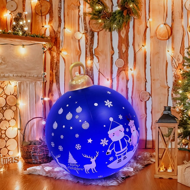 QIPOPIQ Decorated Inflatable Christmas Outdoor 60CM Ball, a vibrant blue inflatable with festive illustrations of Santa, reindeer, snowflakes, and ornaments. Made of durable PVC, it is weather-resistant and ideal for outdoor Christmas inflatables. Displayed in a cozy holiday setting with warm lights and seasonal decor.