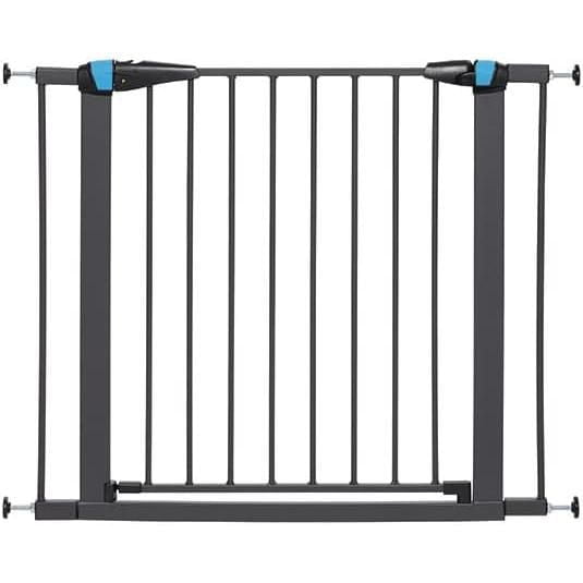 Midwest Homes for Pets 29" High Walk-Thru Steel Pet Gate in graphite finish with pressure-mounted wall-safe design, vertical steel bars, and a 19-inch-wide door that swings both ways and locks automatically for secure indoor pet containment.