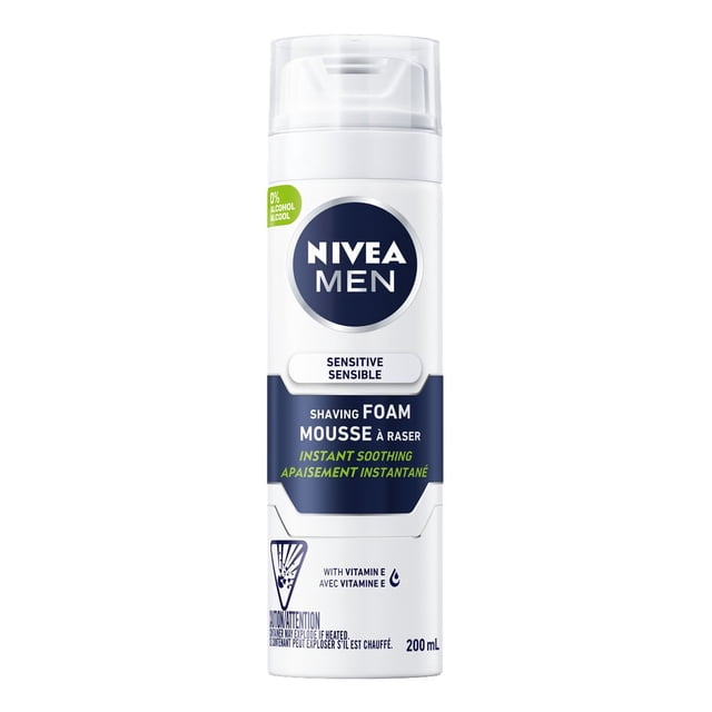 NIVEA MEN Sensitive Skin Shaving Foam in a 200 mL white cylindrical can with clear plastic cap, navy blue label highlighting instant soothing and Vitamin E, designed for men's grooming and sensitive skin protection during shaving.
