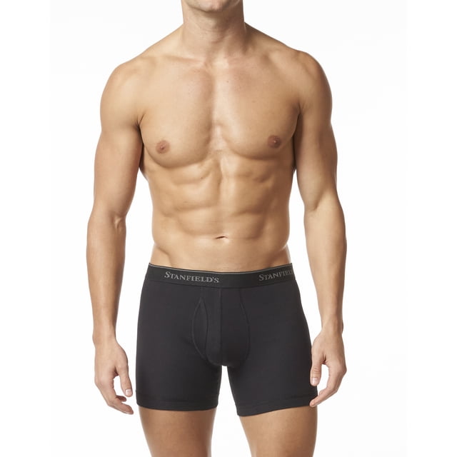 Stanfield's Caleçons Boxeurs Taille Basse en Coton de Qualité Supérieure pour Hommes - Lot de 2, Style 2510. Vue Orientée vers l'Avant d'Un Modèle Portant des Caleçons Boxeurs Noirs avec Pochette avant à Braguette et Taille Élastique avec logo Stanfield's. Fabriqués en Coton Peigné 100 % avec silhouette Ajustée pour un Style Plus Lisse sous les Vêtements.