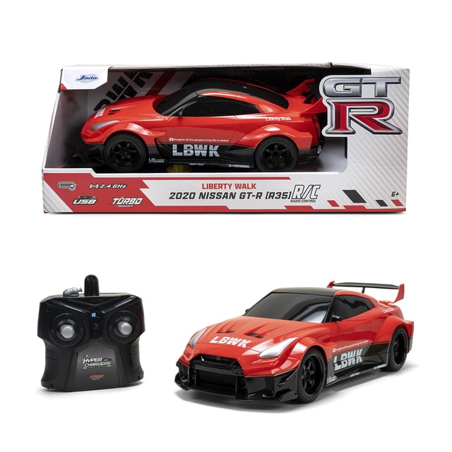 1:16 NISSAN GTR RC showing a red 2020 Nissan GT-R R35 Liberty Walk remote control car with black LBWK decals and rear spoiler, displayed in packaging and with a black 2.4 GHz radio controller, suitable for ages 6 and up.