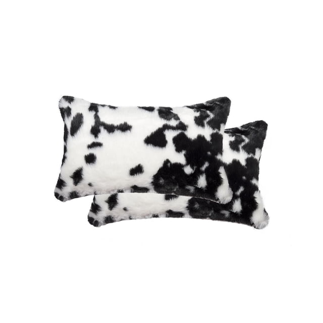 BELTON FAUX FUR PILLOW 12"X20" 2-PACK with two rectangular black and white spotted faux fur pillows made from 100% animal-free acrylic plush fibers, featuring a lush, soft pile and polyfil stuffing, ideal for adding texture to sofas or beds and often used as stylish lumbar support cushions.