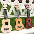 thumbnail image 4 of A Mini Ukulele Toy For Toddlers Early Music Learning Instrument Light Weight 26X10X4Cm Size, 4 of 8