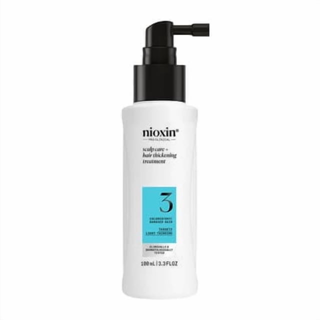 Nioxin Scalp Care + Hair Thickening System 3, a 100ml leave-in treatment designed for colored, dry, and damaged hair with light thinning. The white bottle features a black pump dispenser and a blue label with the number 3. Formulated with niacinamide and biotin to strengthen, nourish, and maintain vibrant color.