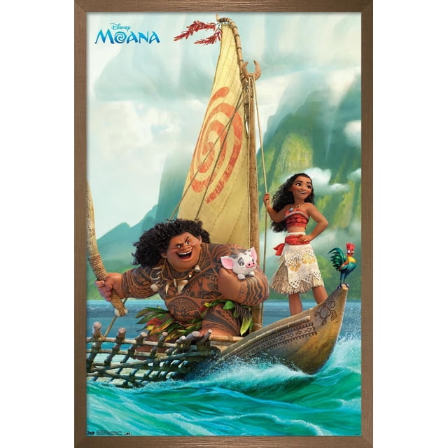 Disney Moana - Group Wall Poster, 22.375" x 34" depicting Moana and Maui on a traditional Polynesian sailing canoe with a beige sail marked by a red spiral, set against blue ocean waves and misty green mountains, with Moana standing at the bow holding a rope and Maui crouched holding a small pig, framed in a brown wooden frame.