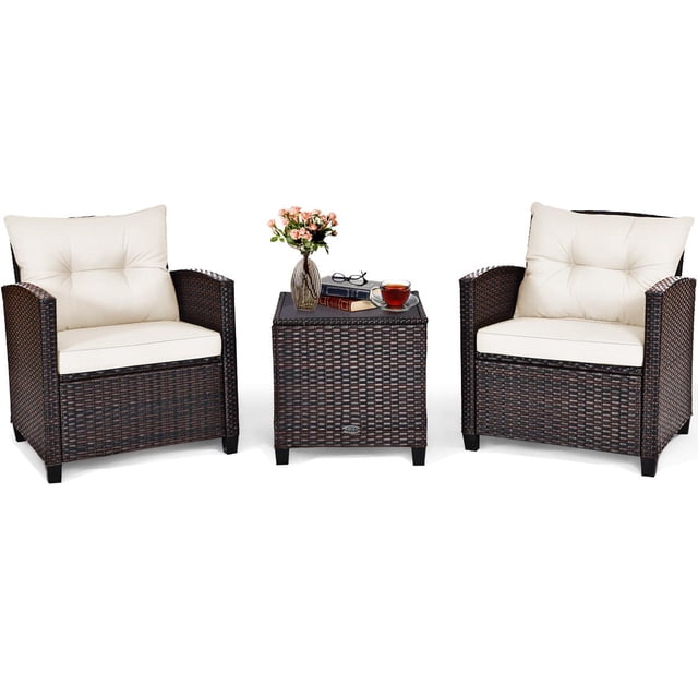Giantex 3 Pieces Patio Furniture Set featuring two PE rattan wicker chairs with white washable cushions and a tempered glass-top table. The set is designed for outdoor use in gardens, poolside, or balconies. The chairs have wide armrests and ergonomic backrests for comfort, while the table provides a sturdy surface for drinks or decor. The rattan is weather-resistant, and the cushions have removable covers for easy cleaning.