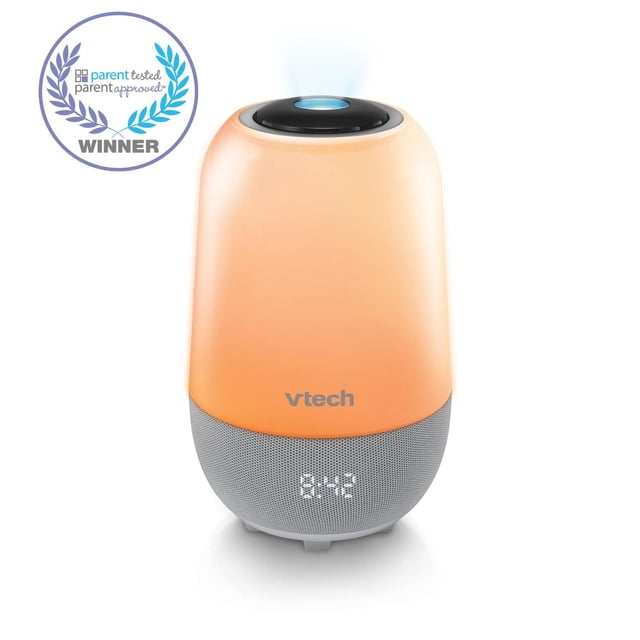 VTech BC8313 V-Hush Pro Sleep Training Soother portable Bluetooth speaker with glowing orange touch night light, gray fabric speaker base showing digital clock, and black top with blue glow-on-ceiling projector emitting soft mist, front-facing on white background with parent tested approved winner badge.