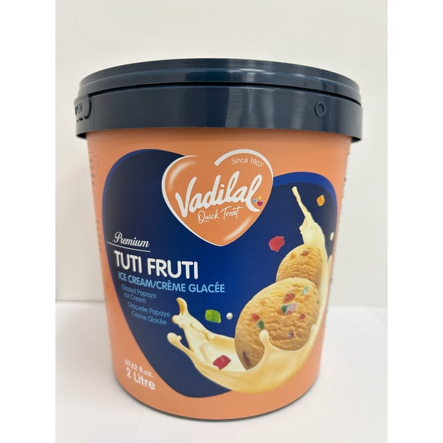 Vadilal Tuti Fruti Ice Cream 2 Ltr tub with a dark blue lid and orange label featuring the Vadilal heart logo. The label highlights premium glazed papaya ice cream with colorful fruit bits and a creamy milk splash, sized 67.62 fl.oz, suitable for family desserts or casual treats.