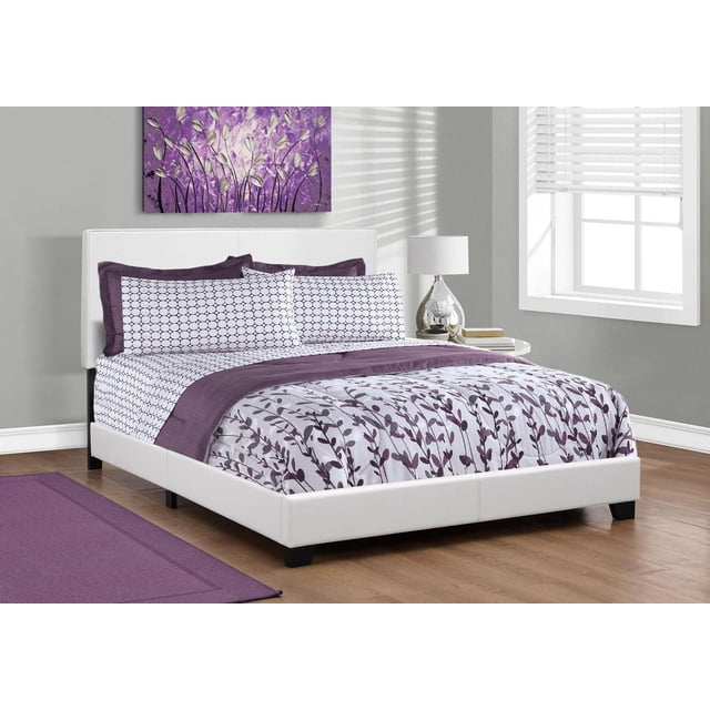 Monarch Specialties Bed, Queen Size, Platform, Bedroom, Frame, Upholstered, Pu Leather Look, Wood Legs, White, transitional queen size platform bed with white PU leather-look upholstery on headboard and frame, supported by dark wood legs, styled with purple and white geometric and floral bedding, set on hardwood floors with a purple area rug, next to a nightstand with a silver lamp and books, near a window with white blinds.